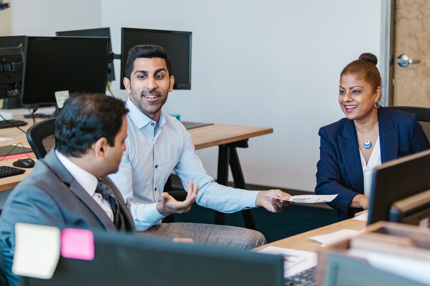 An advisor presenting plan figures to a company's leadership team