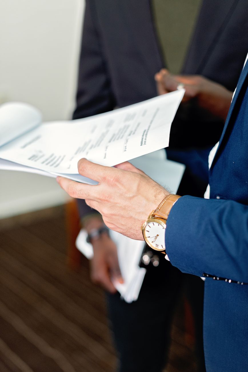 Professionals reviewing documents together across a meeting table